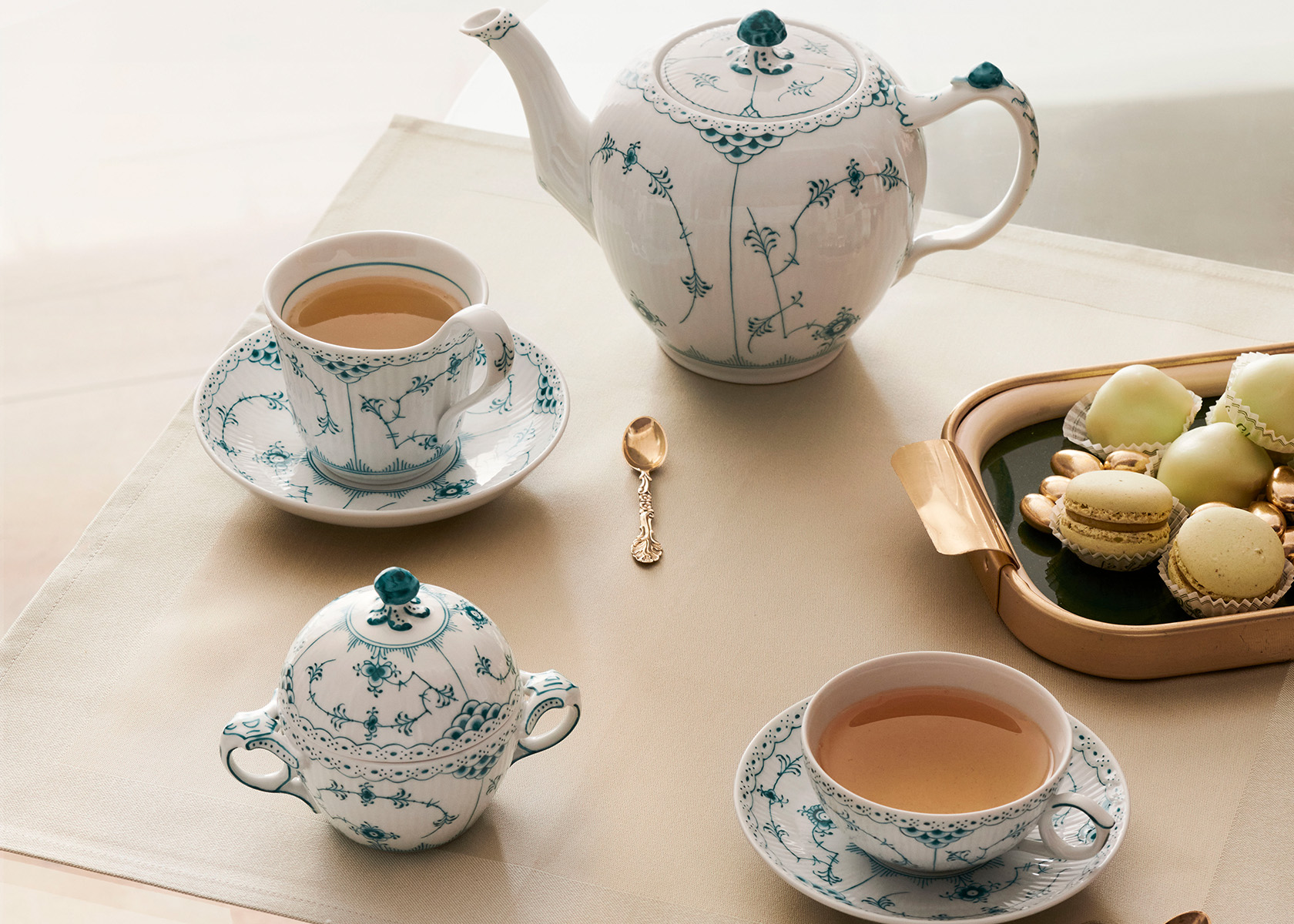 The handcrafted and hand-painted Emerald Fluted Half Lace complete tea set with sugar bowl, teapot, teacup with saucer and coffee cup with saucer and dessert plates